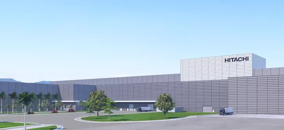 Imagem conceitual de uma nova planta industrial da Hitachi Energy em Pindamonhangaba, com instalação moderna, áreas verdes e acesso para veículos.